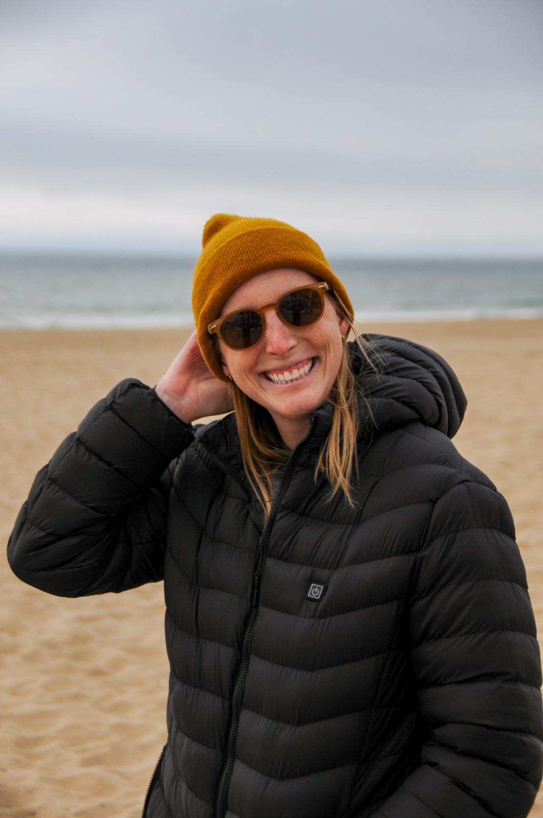 Emily smiling on a South Bay beach